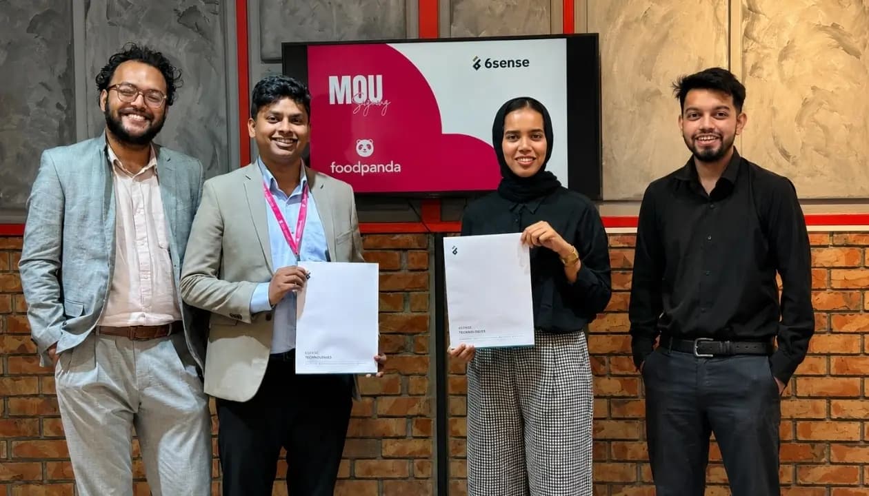 6sense team and Foodpanda representatives at an MOU signing ceremony holding agreement documents