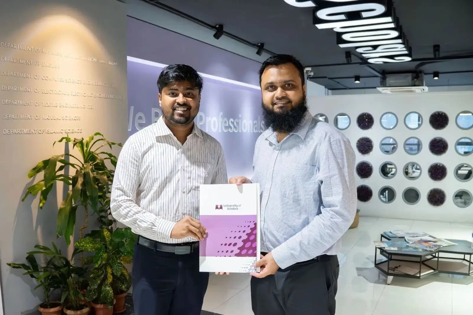 6sense HQ and University of Scholars representatives holding the signed MoU