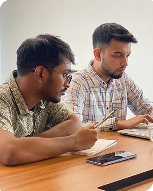 6sense HQ JavaScript developers reviewing a problem