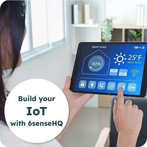 Woman controlling a smart home IoT dashboard on a tablet
